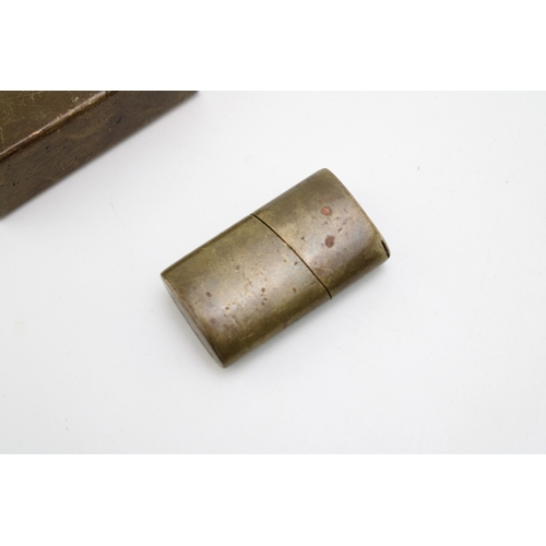 139 - WWI brass trench art style matchbox holder together with a trench art lighter, 6cm tall, (2).