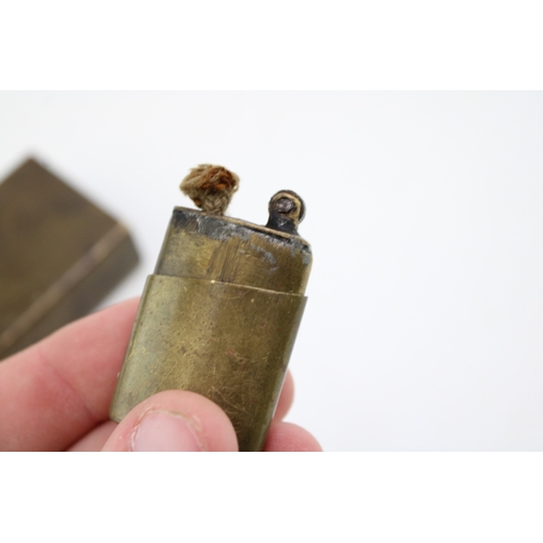 139 - WWI brass trench art style matchbox holder together with a trench art lighter, 6cm tall, (2).