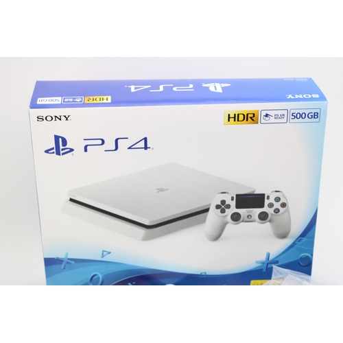 14 - Boxed Playstation 4, Glacier White, 500GB, one controller, vendor states to have factory reset and s... 