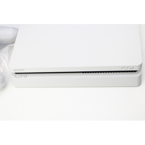 14 - Boxed Playstation 4, Glacier White, 500GB, one controller, vendor states to have factory reset and s... 