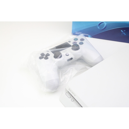 14 - Boxed Playstation 4, Glacier White, 500GB, one controller, vendor states to have factory reset and s... 