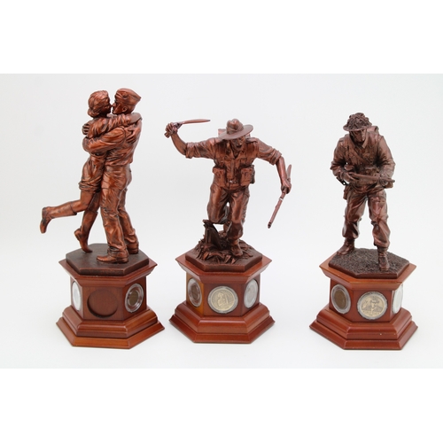 144 - Three Danbury Mint World War Two figures to include the Liberator and others (3), with coins inset t... 