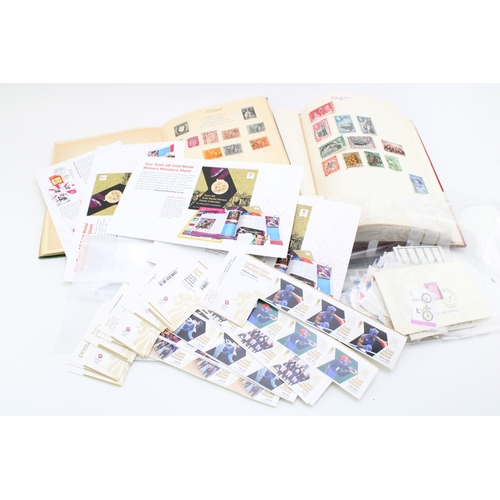 158 - A collection of stamps to include two stamp albums contains 20th century world stamps together with ... 