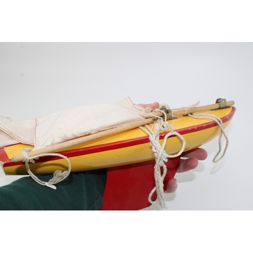 164 - Star Yacht, Birkenhead, pond yacht in yellow and red colour-way, 36cm wide, 47cm tall.
