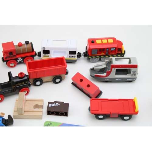 20 - A mixed collection of Brio Toys model railways to include battery operated engine and other similar ... 
