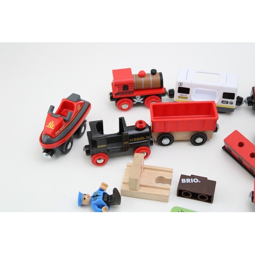 20 - A mixed collection of Brio Toys model railways to include battery operated engine and other similar ... 