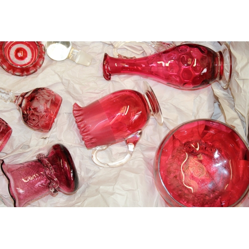 31 - A collection of cranberry glass to include bon bon dishes, glasses and other similar items, (Qty).