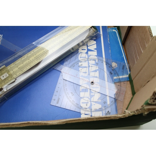 48 - A collection of technical drawing instruments including a slide rule, Breton Plotter, Navigational P... 