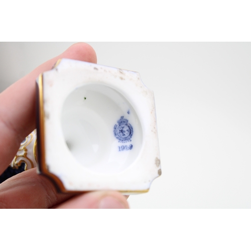 7 - Royal Worcester two handled pedestal vase decorated with floral sprays and gilt highlights, together... 