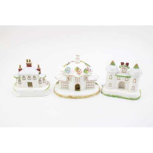 9 - Coalport 'Twin Towers', 'Keepers Cottage' and 'The Parasol House' 11cm tall, (3).