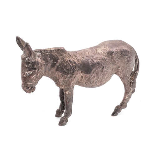 A realistically cast sterling silver model of a donkey, in a standing position, fully hallmarked, commissioned by the vendor's family at Pidducks of Hanley, 1085.7g / 34.9t.oz, 20cm long, 15cm tall, London 1975.