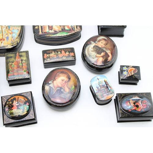 A collection of Russian lacquer boxes and eggs to include Cathedrals ...