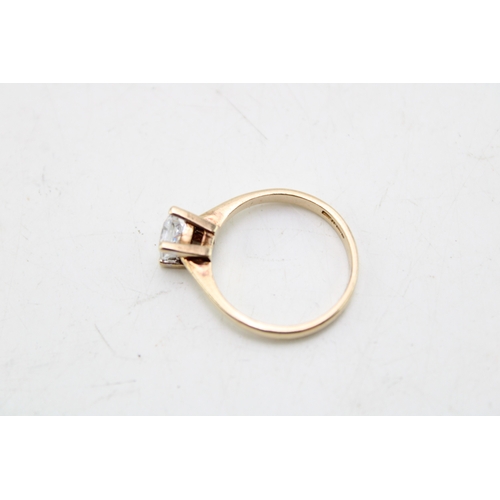 A 9ct gold and white quartz solitaire dress ring, the emerald cut stone ...
