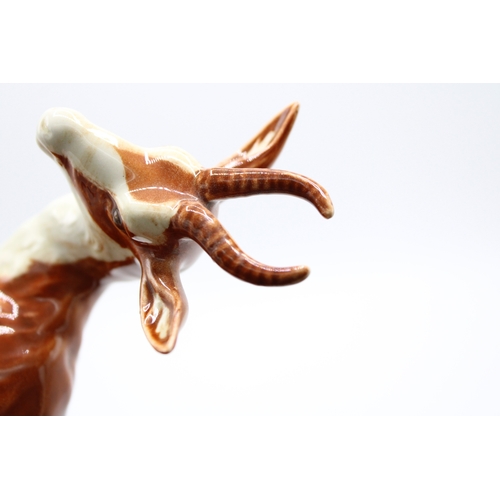 56 - Beswick Springbok 1048 (left antler repaired).