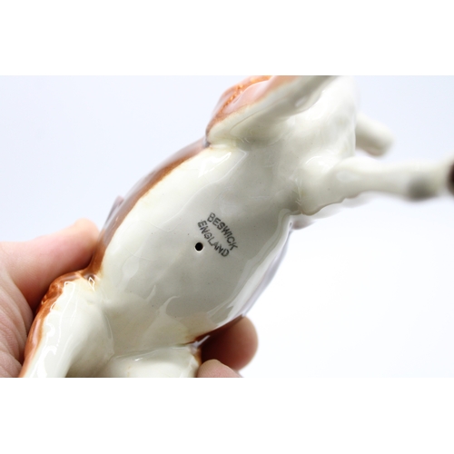 56 - Beswick Springbok 1048 (left antler repaired).