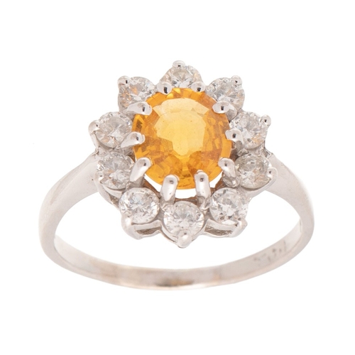 187 - An 18ct white gold, diamond and yellow sapphire dress ring of flowerhead form, set with central oval... 