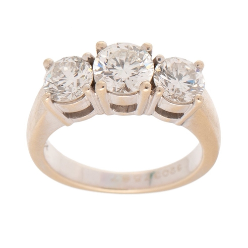327 - An 18ct white gold and diamond three stone ring the central stone of approximately 1ct, 6.47mm diame... 