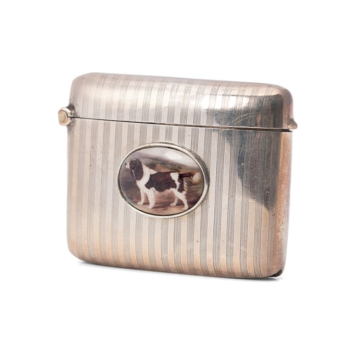 55 - A silver vesta case of curved form with engine turned engraving and applied plaque depicting a worki... 