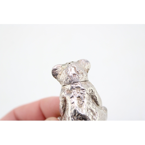 140 - An early 20th century novelty silver pepperette or pepper pot, in the form of a seated teddy bear, C... 