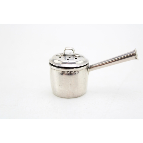 143 - An early 20th century novelty pepperette or pepper pot in the form of a saucepan with trumpet handle... 
