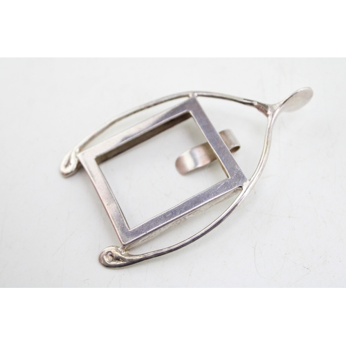 149 - A silver badge holder, of wishbone form with internal rectangular frame, Walker and Hall, London 190... 