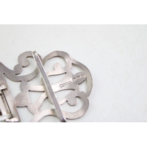 150 - A silver nurse's buckle of scrolling strapwork form with engraved detail, William Clarke & Son, Ches... 