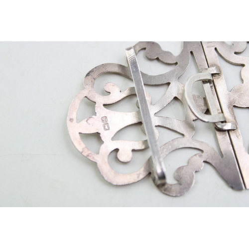 150 - A silver nurse's buckle of scrolling strapwork form with engraved detail, William Clarke & Son, Ches... 