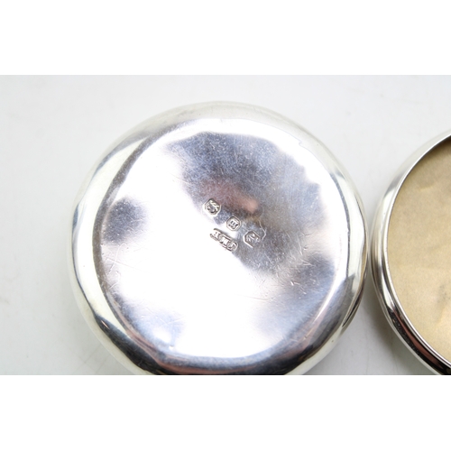 152 - A Victorian silver pill box of circular form, with scrolling acanthus leaf border to the lid and gil... 