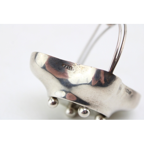 153 - A silver miniature basket, of quatrafoil form with handle over, raised on four ball feet, Adie & Lov... 