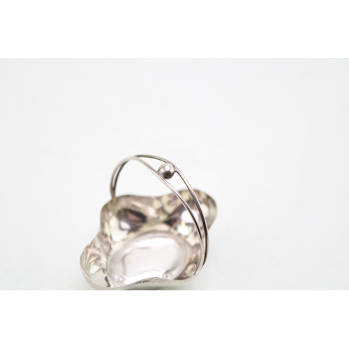 153 - A silver miniature basket, of quatrafoil form with handle over, raised on four ball feet, Adie & Lov... 
