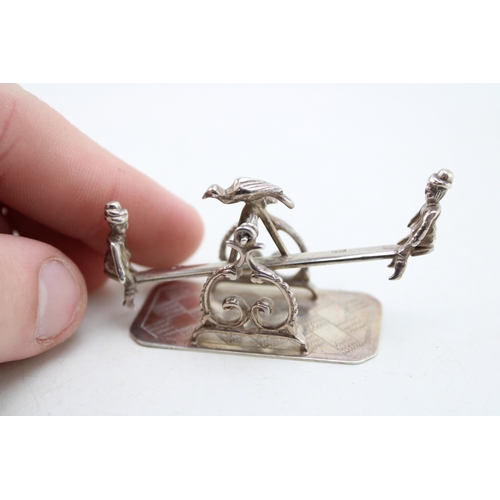 157 - A turn of the 20th century Dutch silver model of a see-saw, fully balanced and movable with a child ... 