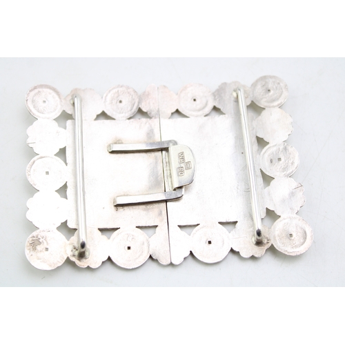 166 - A Chinese 19th century silver nurse's buckle, of rectangular form with characters to the centre and ... 