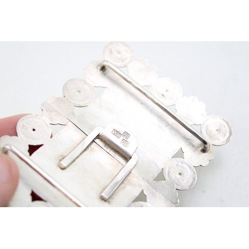 166 - A Chinese 19th century silver nurse's buckle, of rectangular form with characters to the centre and ... 