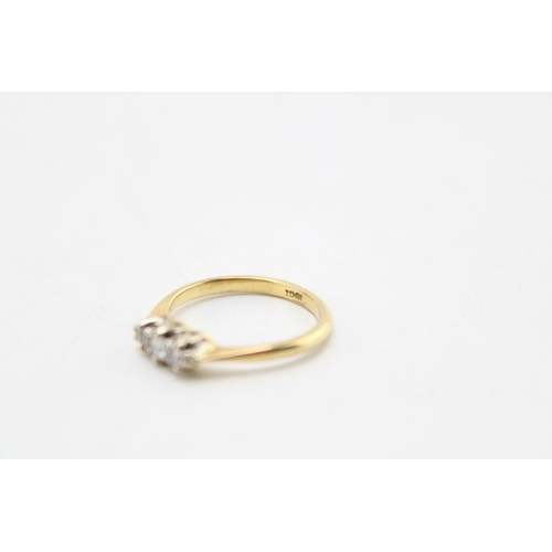 183 - An 18ct gold and diamond three stone ring, the old European cut diamonds of slightly graduated size,... 