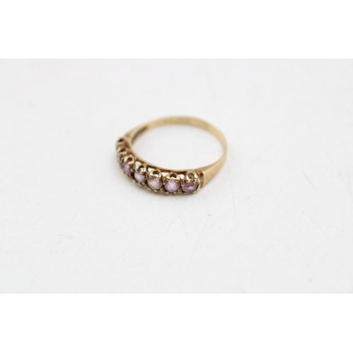 208 - A 9ct gold lady's ring, set with seven stones, likely rose quartz, size P, 1.7g.