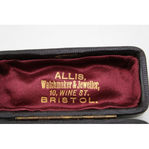 220 - An Art Nouveau 9ct gold, tourmaline and seed pearl bar brooch, the emerald cut central stone of appr... 