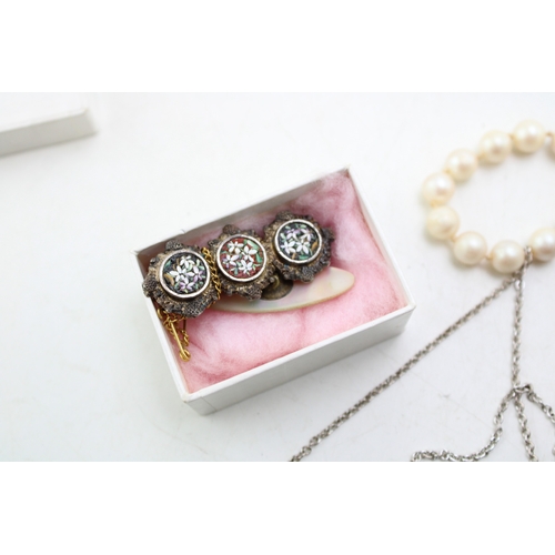 229 - A group of vintage silver and costume jewellery including an unmarked white metal modernist pendant ... 