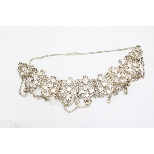 229 - A group of vintage silver and costume jewellery including an unmarked white metal modernist pendant ... 