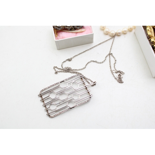 229 - A group of vintage silver and costume jewellery including an unmarked white metal modernist pendant ... 