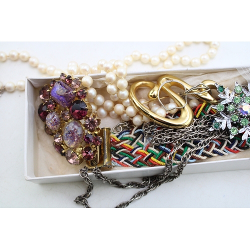 229 - A group of vintage silver and costume jewellery including an unmarked white metal modernist pendant ... 