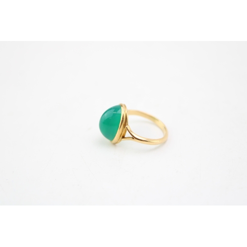 234 - A gold and chrysoprase set ring, the oval polished sloped cabochon approximately 12.3 by 8.6 by 7.9m... 