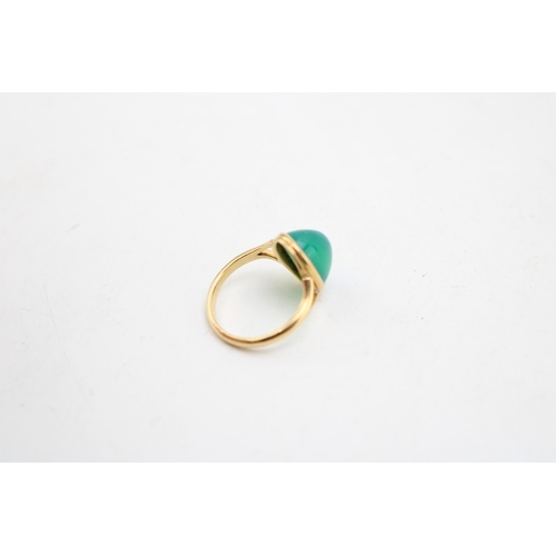 234 - A gold and chrysoprase set ring, the oval polished sloped cabochon approximately 12.3 by 8.6 by 7.9m... 