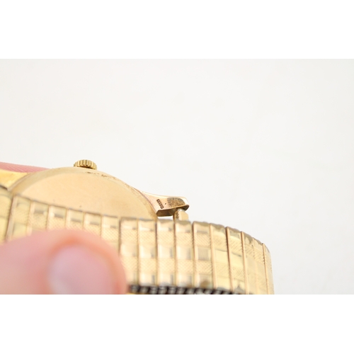 30 - A gentleman's 9ct gold cased, vintage Omega watch, the signed champagne dial with baton numerals, mi... 