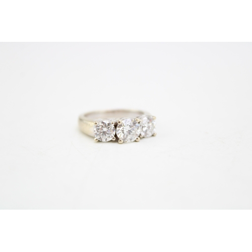 327 - An 18ct white gold and diamond three stone ring the central stone of approximately 1ct, 6.47mm diame... 