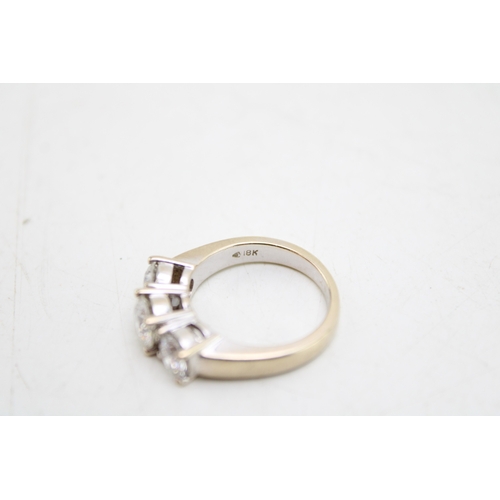 327 - An 18ct white gold and diamond three stone ring the central stone of approximately 1ct, 6.47mm diame... 