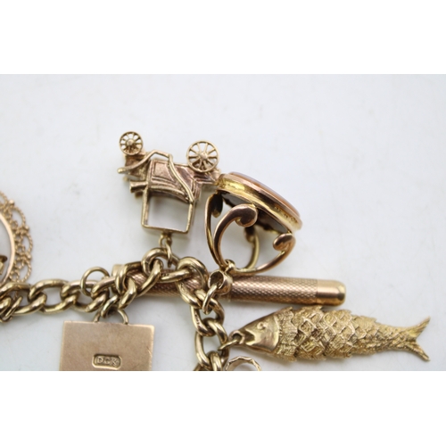 340 - A 9ct curb link gold charm bracelet, having rectangular padlock clasp and with fourteen oversized 9c... 