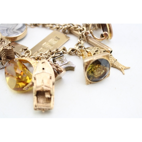 340 - A 9ct curb link gold charm bracelet, having rectangular padlock clasp and with fourteen oversized 9c... 