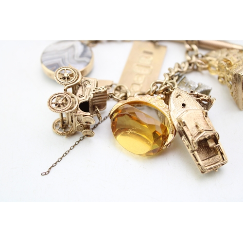 340 - A 9ct curb link gold charm bracelet, having rectangular padlock clasp and with fourteen oversized 9c... 