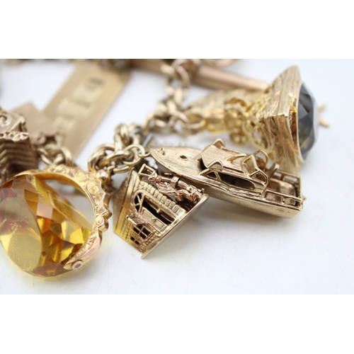 340 - A 9ct curb link gold charm bracelet, having rectangular padlock clasp and with fourteen oversized 9c... 