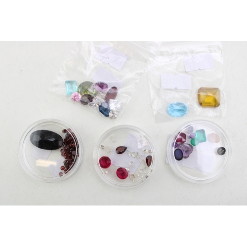341 - A group of vintage loose gemstones, including garnets, tourmaline, heart cut amethyst, topaz, agate ... 